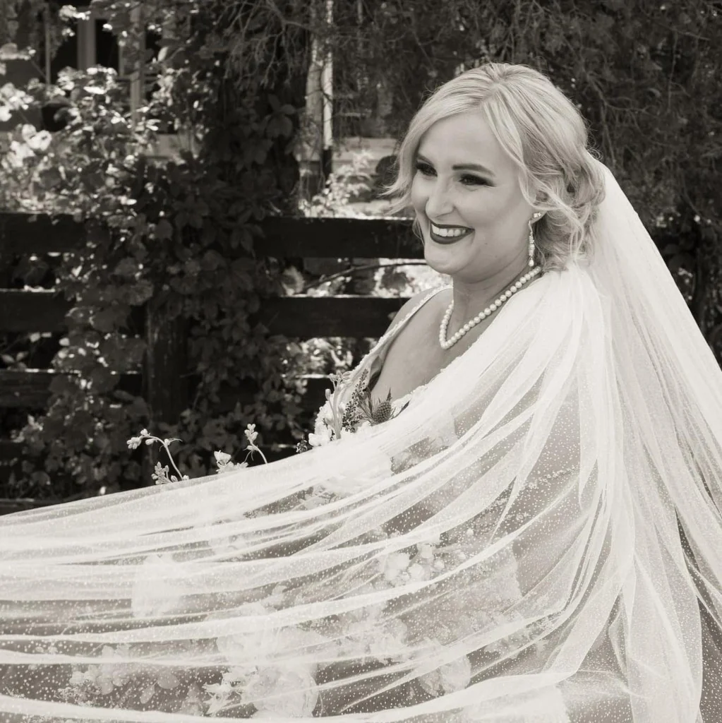 Cali in bridal styling with veil and updo.